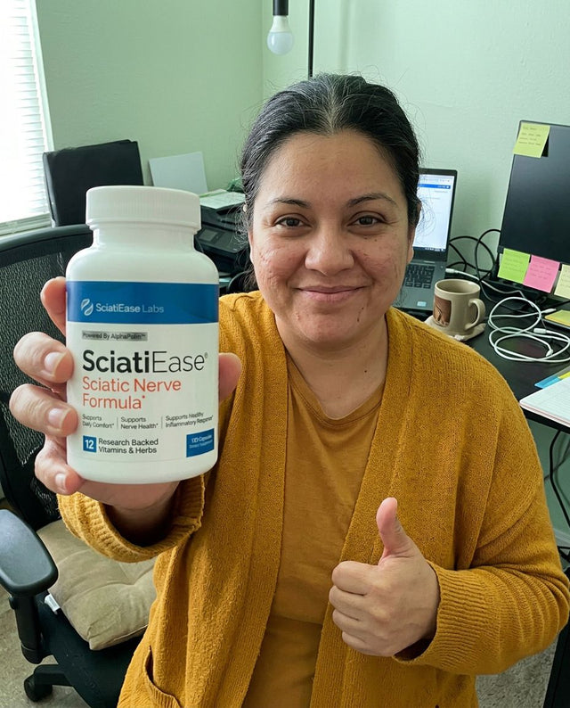 Carla V. holding a bottle of SciatiEase