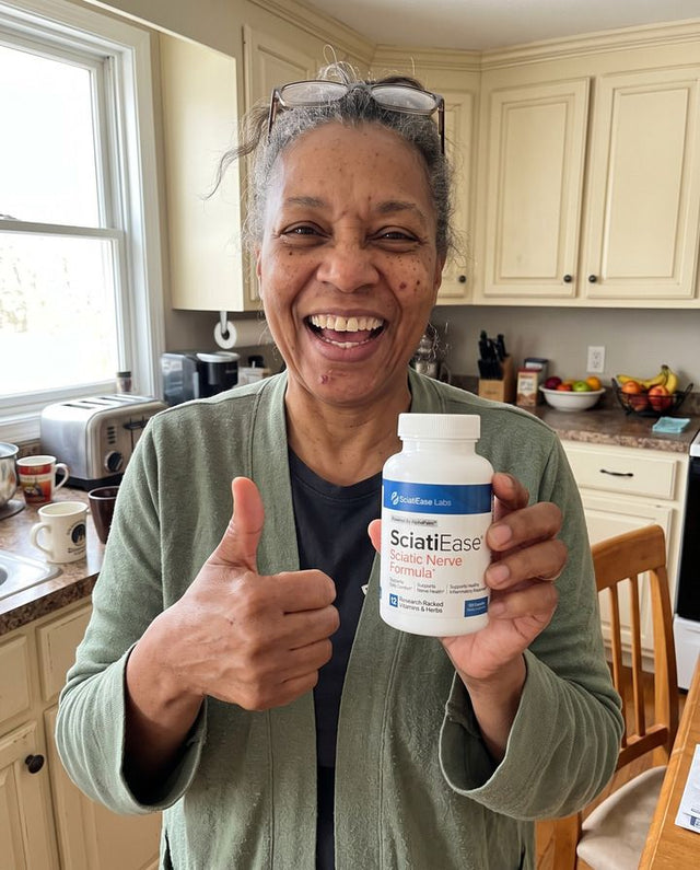 Yvette S. holding a bottle of SciatiEase
