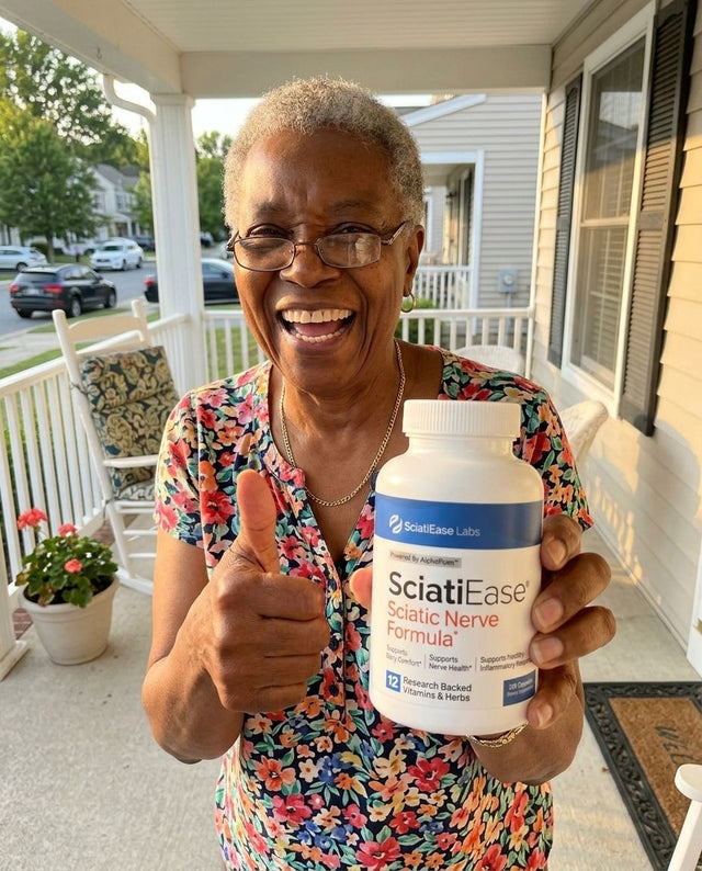 Deloris P. holding a bottle of SciatiEase